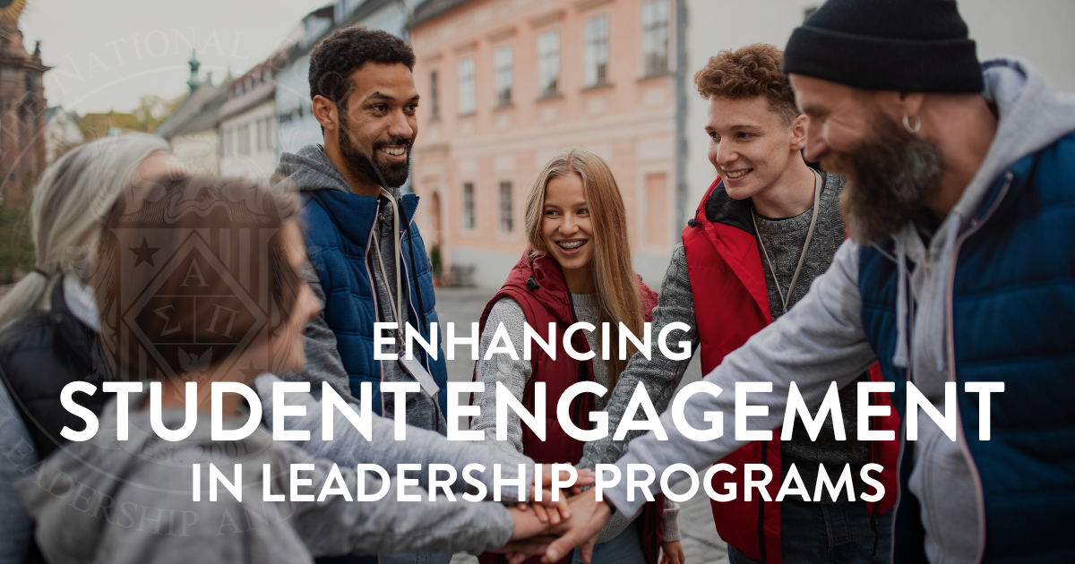 A group of young student leaders in a huddle getting ready to take on a task.