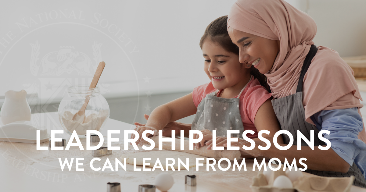Mom teaching daughter how to bake and showing her the leadership skills of patience and teamwork